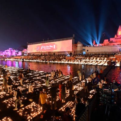 AYODHYA, INDIA NOVEMBER 11: People lighting earthen lamps at Ram ki Paidi during Diya Deepotsav (Diwali celebrations) on November 11, 2023 in Ayodhya, India. Ayodhya is all set to celebrate a grand 'Deepotsav' on the eve of Diwali as 24 lakh traditional earthen lamps, or diyas, at 51 ghats of Saryu river will illuminate the temple city at the same time, setting a world record. The festivities would commence at 3pm and would be inaugurated by chief minister Yogi Adityanath. Almost the entire UP cabinet ministers along with the High Commissioners and Ambassadors of over 50 countries will also participate in the program. (Photo by Deepak Gupta/Hindustan Times via Getty Images)
